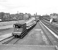 1BKH’ Rail delivery train’ sets back into Permanent Way Depot, Baggs Yard, past Castleton East Junction Signal box.  BK Hilton.